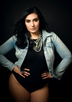 Portrait of a curvy woman in a denim jacket