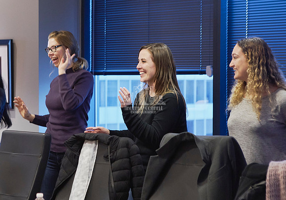 Women smiling and dancing to music during a workshop