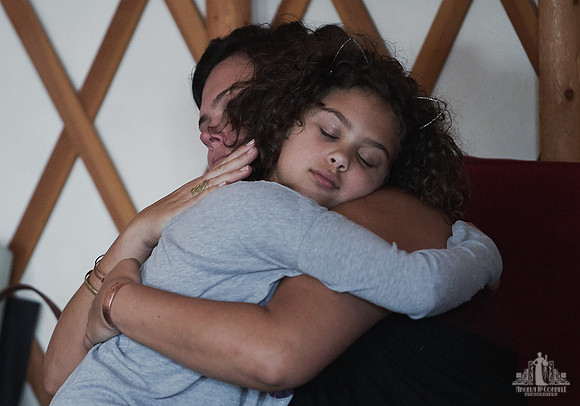 A mother and daughter hug during an exercise at a mother and daughter workshop by Vancouver workshop and retreat photographer Angela McConnell