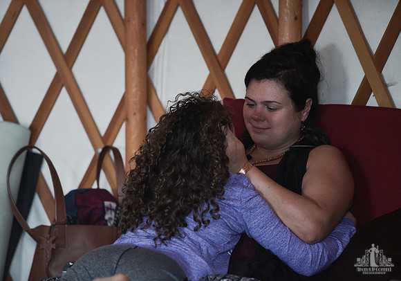 A mother listens and smiles as her daughter is speaking during an exercise at a mother and daughter workshop by Vancouver workshop and retreat photographer Angela McConnell