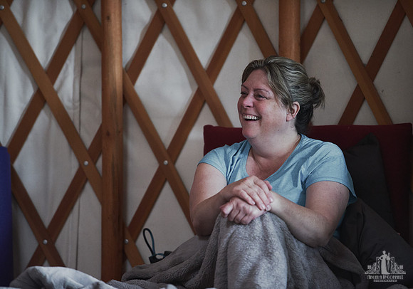 A mother laughs during an exercise  at a mother and daughter workshop by Vancouver workshop and retreat photographer Angela McConnell