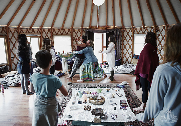 Mother and daughters do a trust fall exercise  at a mother and daughter workshop by Vancouver workshop and retreat photographer Angela McConnell