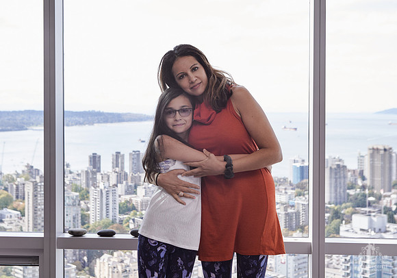 A mother and daughter hug during portraits at a Wildflower mother and daughter workshop by Vancouver workshop and retreat photographer Angela McConnell
