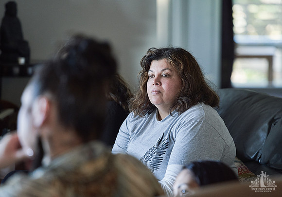 A woman listens during a group exercise Women smile and laugh together during a group exercise at a womens' retreat at Halfmoon Haven on the Sunshine Coast, BC by Vancouver workshop and retreat photog