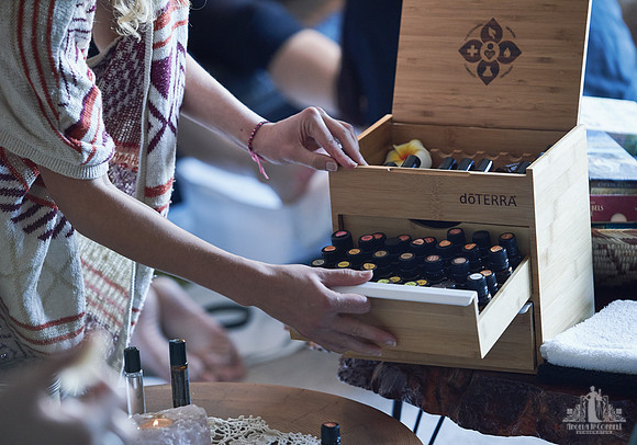 Essential oils are select for a massage exercise at a womens' retreat at Halfmoon Haven on the Sunshine Coast, BC by Vancouver workshop and retreat photographer Angela McConnell
