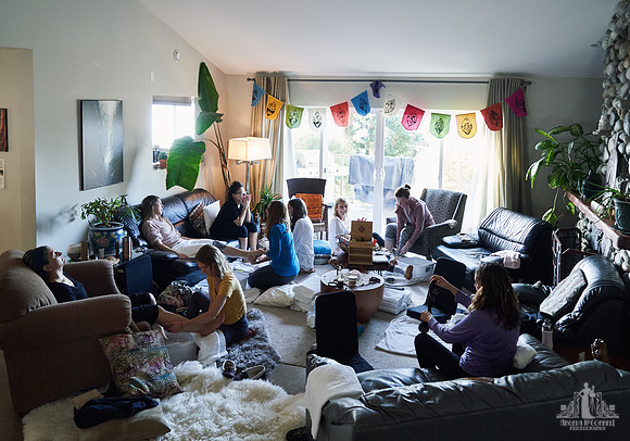 A group of women give and receive massages at a womens' retreat at Halfmoon Haven on the Sunshine Coast, BC by Vancouver workshop and retreat photographer Angela McConnell