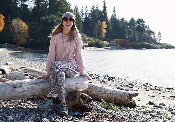 Portrait of a woman smiling on the beach at a womens' retreat at Halfmoon Haven on the Sunshine Coast, BC by Vancouver workshop and retreat photographer Angela McConnell