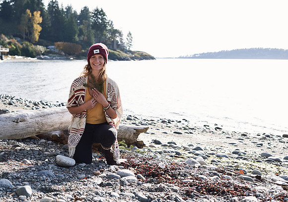 Portrait of a woman smiling on the beach at a womens' retreat at Halfmoon Haven on the Sunshine Coast, BC by Vancouver workshop and retreat photographer Angela McConnell