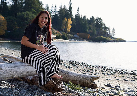 Portrait of a woman smiling on the beach at a womens' retreat at Halfmoon Haven on the Sunshine Coast, BC by Vancouver workshop and retreat photographer Angela McConnell