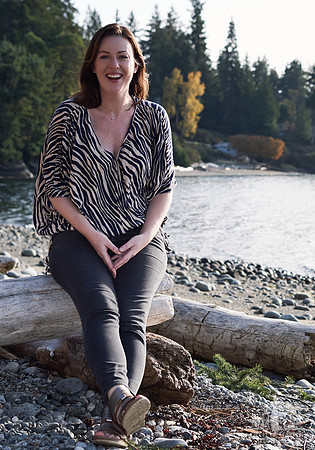 Portrait of a woman smiling on the beach at a womens' retreat at Halfmoon Haven on the Sunshine Coast, BC by Vancouver workshop and retreat photographer Angela McConnell