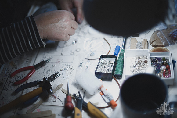 Personal branding image of a jeweller working on a piece of jewellery